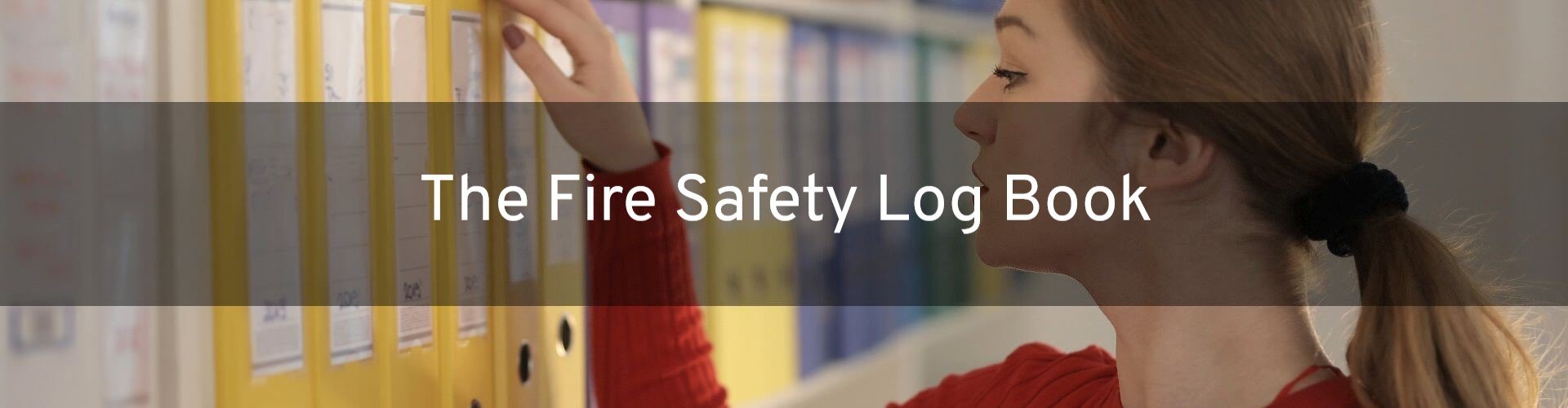 A woman reaching for a yellow ring binder folder on an office shelf, with text overlay reading: The Fire Safety Log Book.